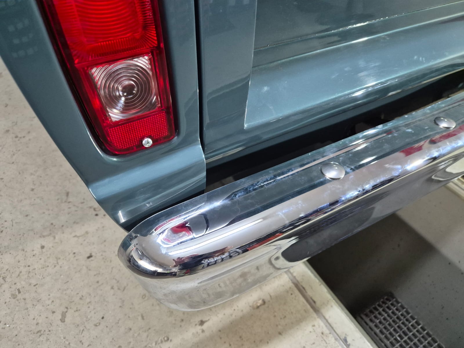 Ford F100 vertical rear lamp and chrome bumper detail